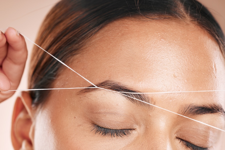eyebrows grooming and woman threading hair on fac 2025 04 06 08 24 45 utc1